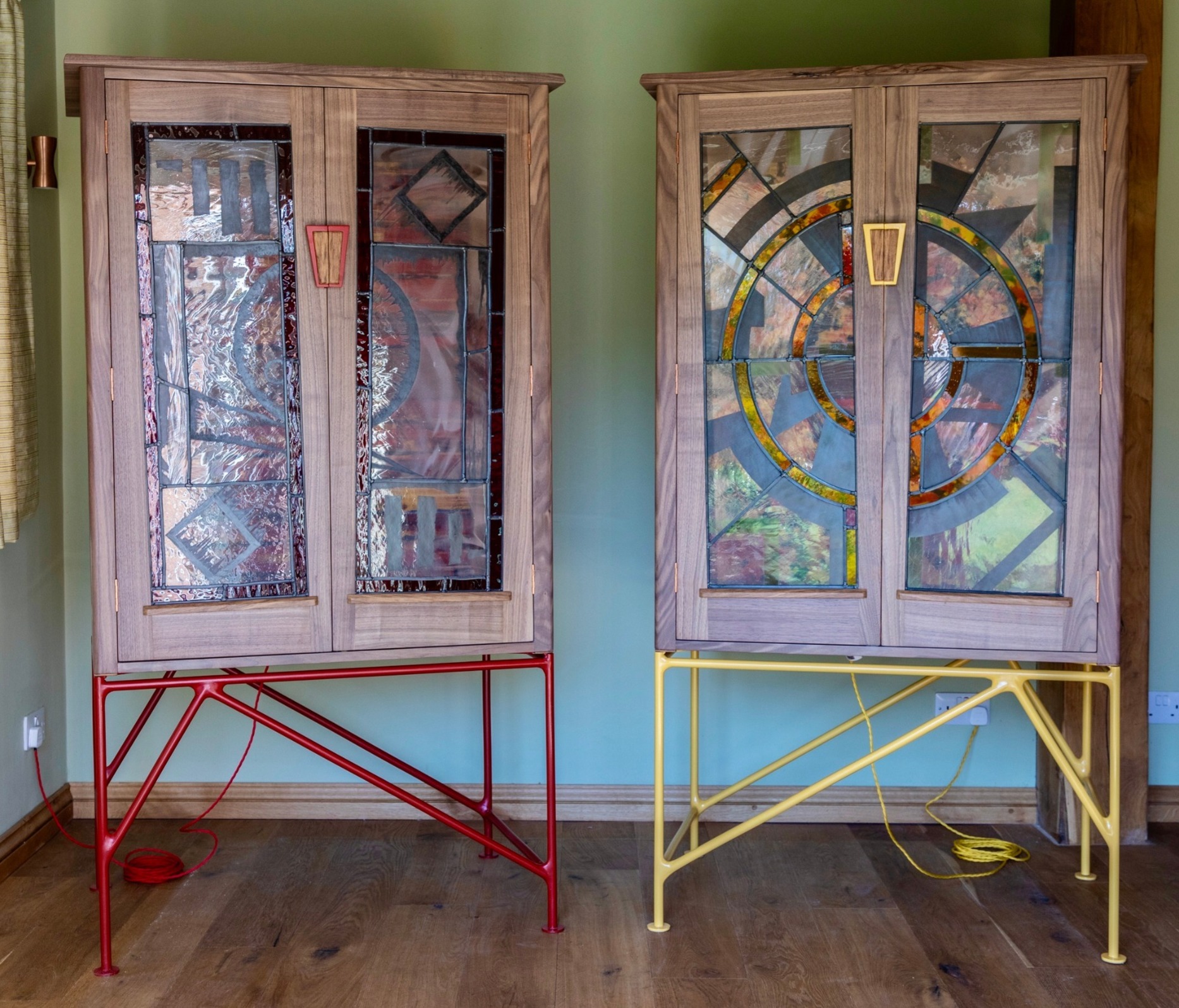 Tim Germain - A pair of gentleman's wardrobes in American black walnut and brown English oak with powder-coated steel legs (by Danny Sharp of Blunt Fabrications) and stained glass panels (by Danielle Hopkinson)